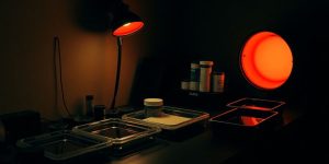 Darkroom with developing trays and film canisters.